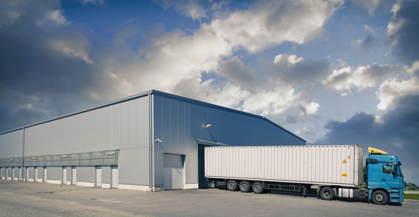 Shipping truck being loaded at a warehouse