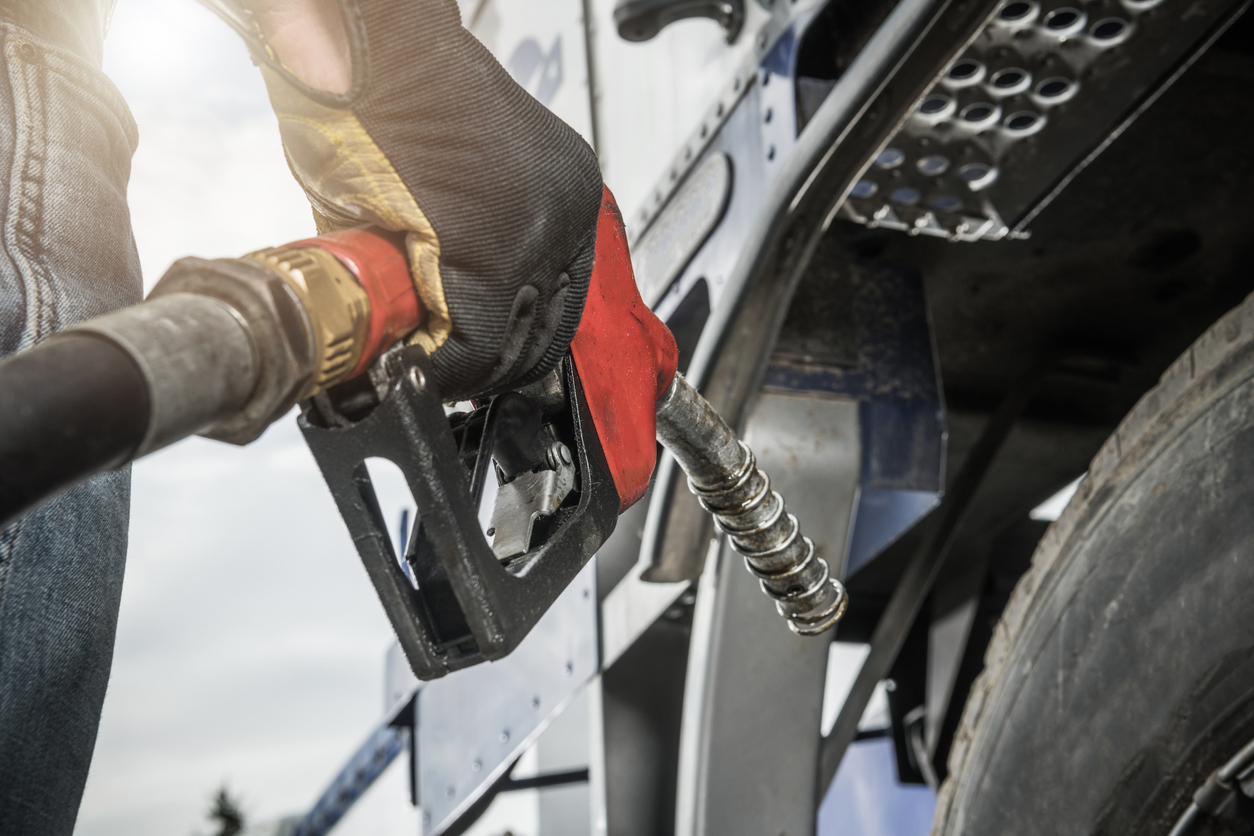 Truck Driver Hold Fuel Pump Nozzle in His Hand